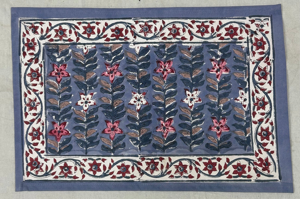 Hand block printed floral table mat in slate blue and crimson